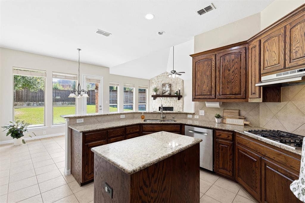 7710 Keith Lane, Sachse, TX 75048 Chef's kitchen with granite countertops