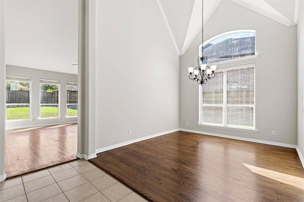 7710 Keith Lane, Sachse, TX 75048 Dining area off the living room and kitchen. Beautiful hardwood floors