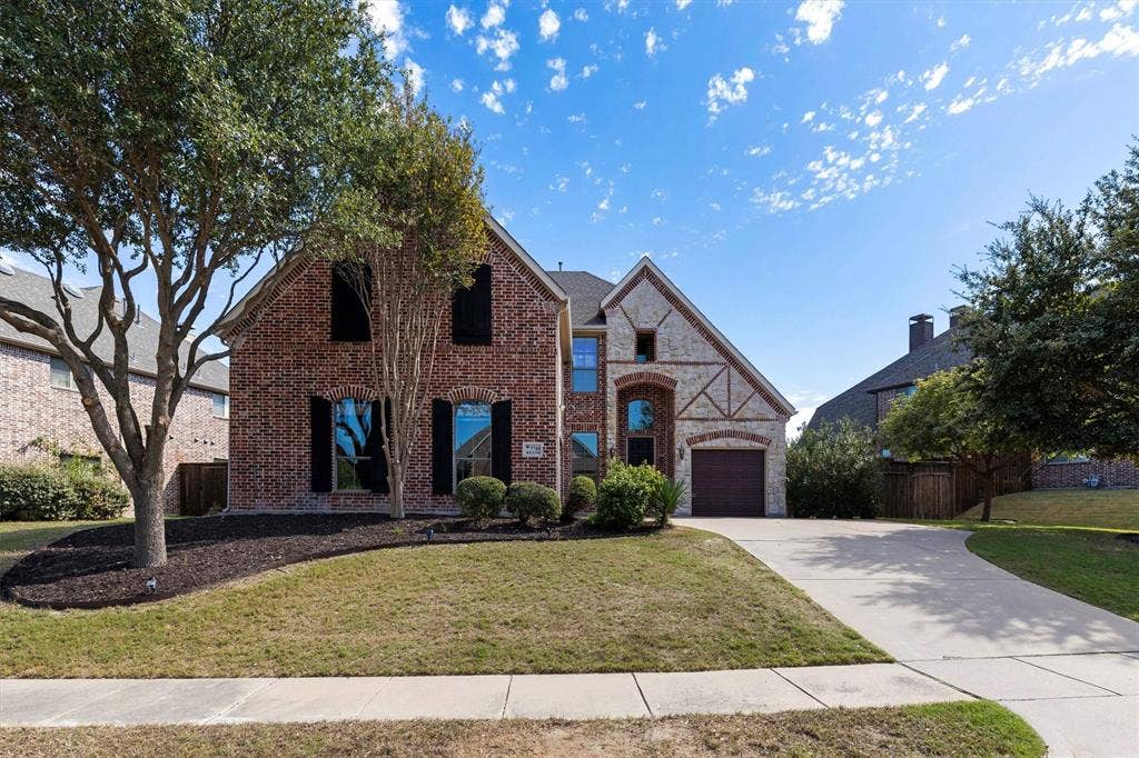 7710 Keith Lane, Sachse, TX 75048 Mature trees, stained cedar shutters, brick and stone exterior. Perfect place to call home!