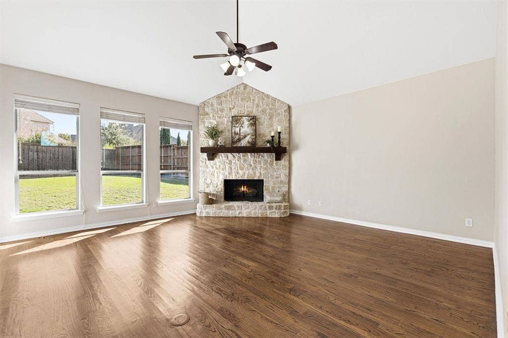 7710 Keith Lane, Sachse, TX 75048 Enjoy the abundant natural light in the living room