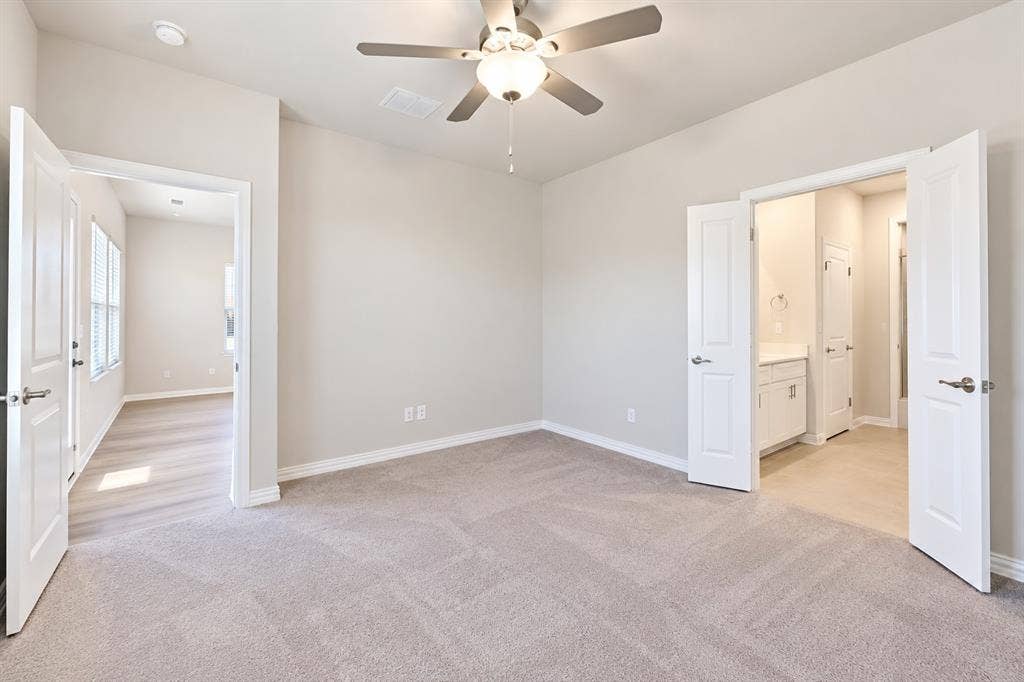 Carpeted room featuring a ceiling fan, recessed lighting, and a white vanity with a rectangular sink