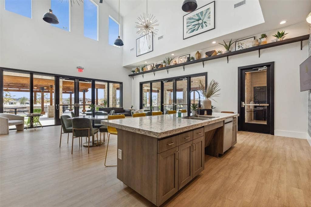 High ceilings with upper windows and pendant lighting