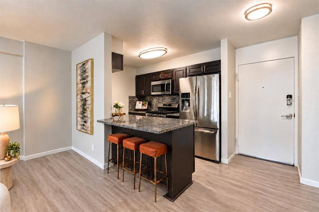 3883 Turtle Creek Boulevard, #317, Dallas, TX 75219 Kitchen and Breakfast Bar | Virtually Staged