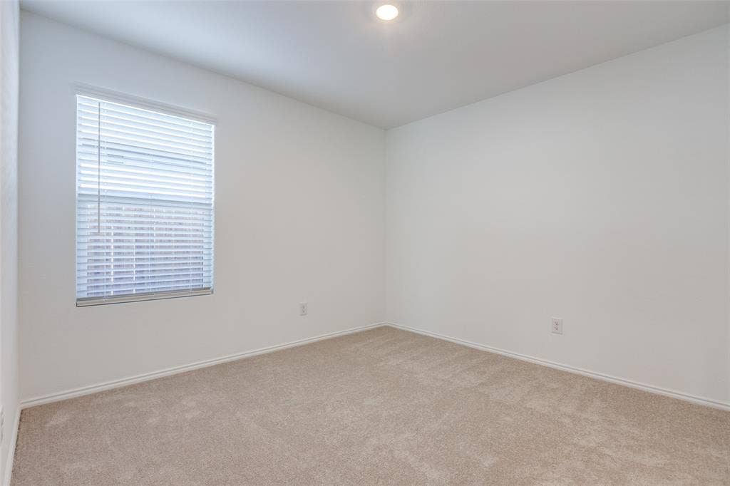 9216 Grackle Place, McKinney, TX 75071 View of carpeted spare room