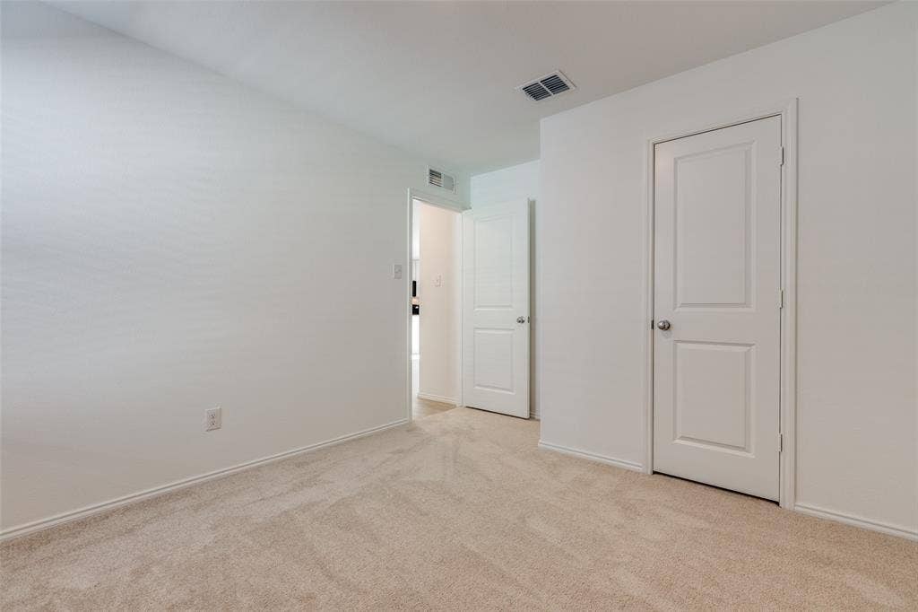 9216 Grackle Place, McKinney, TX 75071 View of carpeted empty room