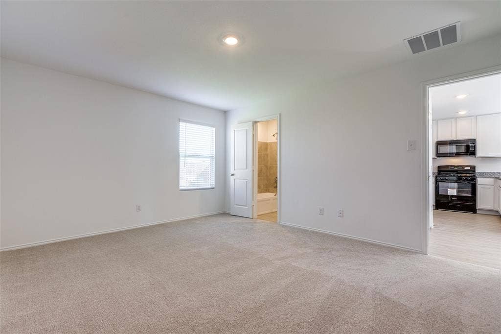 9216 Grackle Place, McKinney, TX 75071 Unfurnished room with light colored carpet