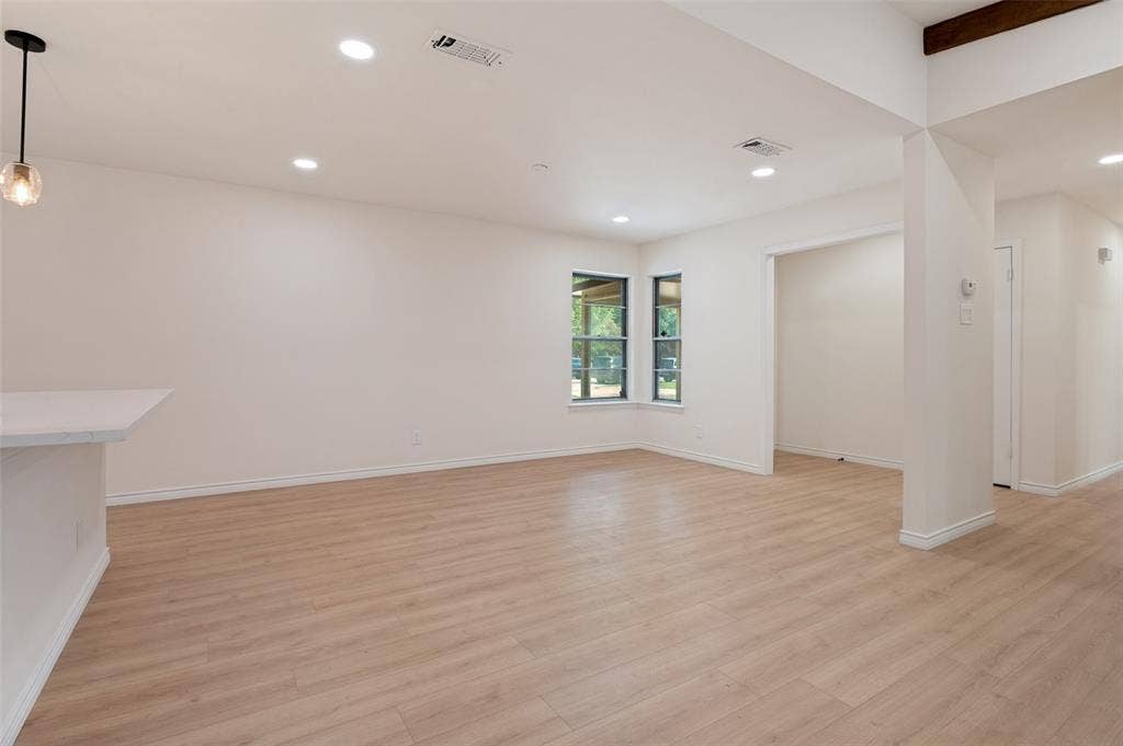 417 Keats Circle, Irving, TX 75061 Open interior featuring wood-finish flooring, recessed lighting, a built-in counter, and multi-pane windows