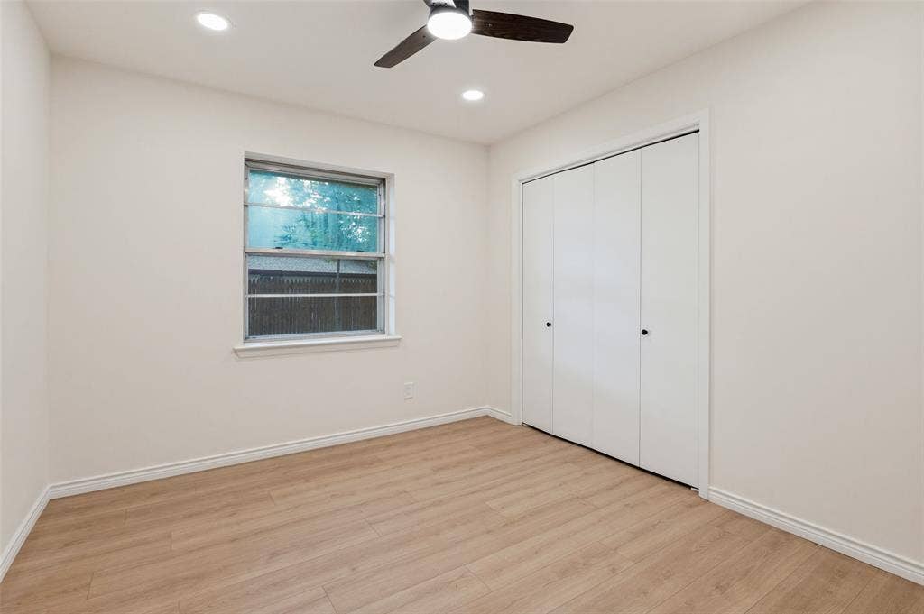417 Keats Circle, Irving, TX 75061 Interior space featuring wood-finish flooring, recessed lighting, a ceiling fan, and a built-in closet with folding doors
