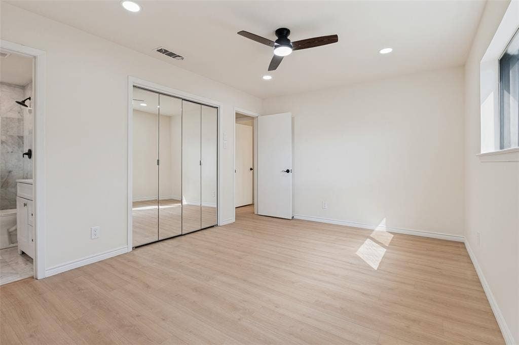 417 Keats Circle, Irving, TX 75061 Neutral interior space featuring wood-finish flooring, recessed lighting, a modern ceiling fan, and floor-to-ceiling mirrored closet doors