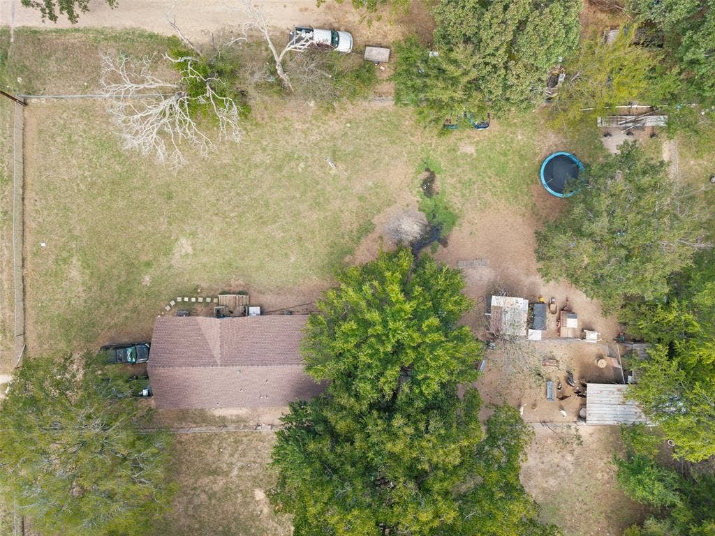 1219 Green Tree Acres Road, Kemp, TX 75143 Expansive lot featuring mature trees, perimeter fencing, and established vegetation