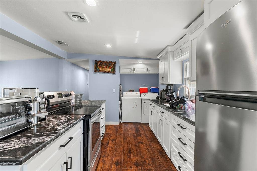 1219 Green Tree Acres Road, Kemp, TX 75143 Kitchen featuring white shaker-style cabinetry, high-contrast patterned countertops, wood-finish flooring, stainless steel appliances, and recessed lighting