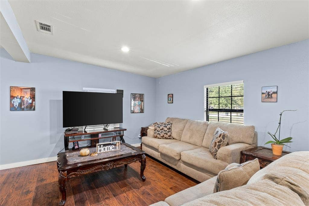1219 Green Tree Acres Road, Kemp, TX 75143 Room interior featuring wood-finish flooring, recessed lighting, and a window with a grid pattern