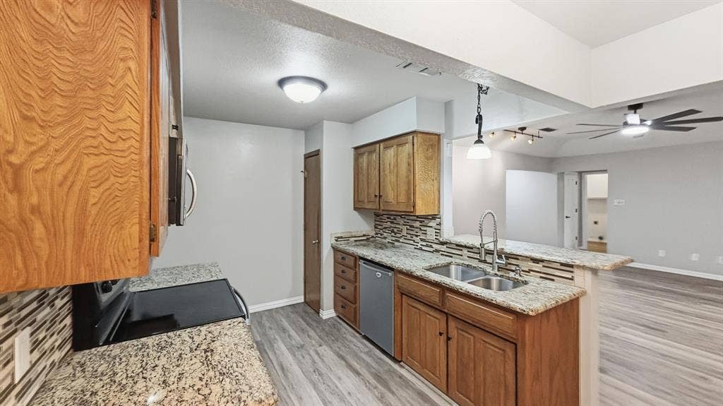 1903 W Spanish Oak Drive, Granbury, TX 76048 Looking from breakfast room to kitchen/living
