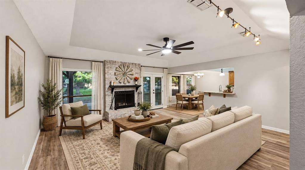 1903 W Spanish Oak Drive, Granbury, TX 76048 Large open living room with brick fireplace