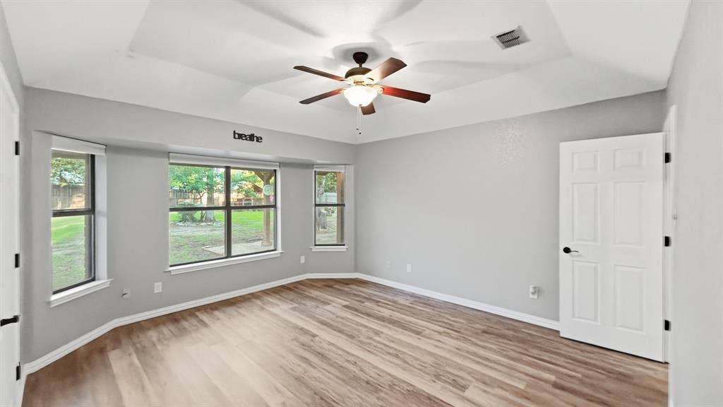 1903 W Spanish Oak Drive, Granbury, TX 76048 Another view of primary bedroom and windows