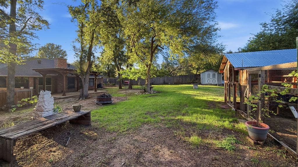 1903 W Spanish Oak Drive, Granbury, TX 76048 Chicken Coop, potting bench, storage building.