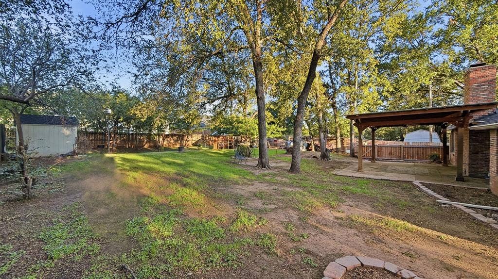 1903 W Spanish Oak Drive, Granbury, TX 76048 Super size back yard with trees!