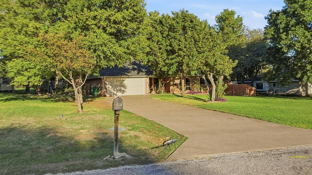1903 W Spanish Oak Drive, Granbury, TX 76048 Front view of the home. Home faces West