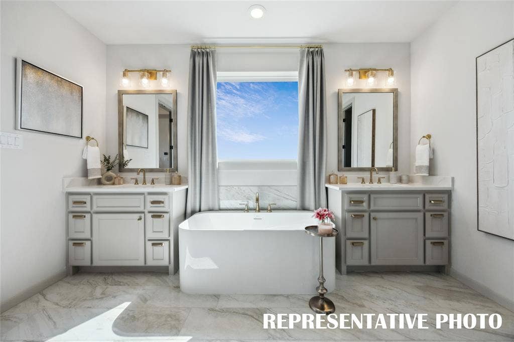 1812 Vetiver Glow Drive, Celina, TX 75009 Filled with style and offering plenty of room for two, this owner's bath is the perfect place to start or end your day! REPRESENTATIVE PHOTO