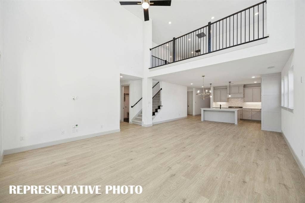 1401 Mistflower Lane, Celina, TX 75009 Our Versailles plan features a game room with open railing that overlooks the family room below creating a multi-level entertainment area! REPRESENTATIVE PHOTO