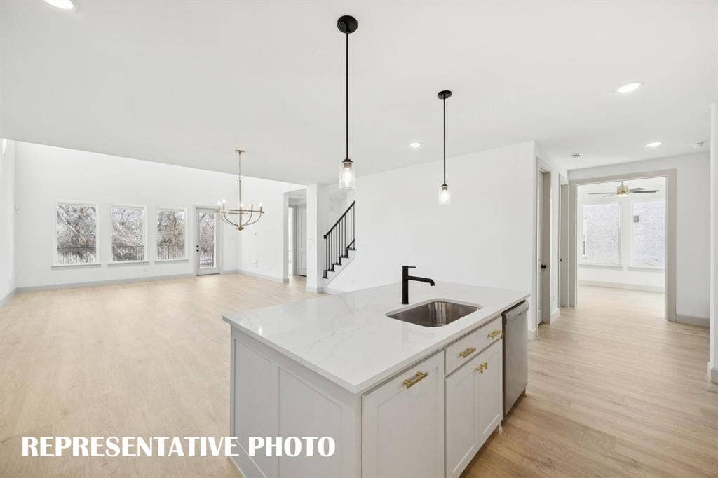 1401 Mistflower Lane, Celina, TX 75009 The chef will never be left out of the party in this wonderful open concept dream home! REPRESENTATIVE PHOTO