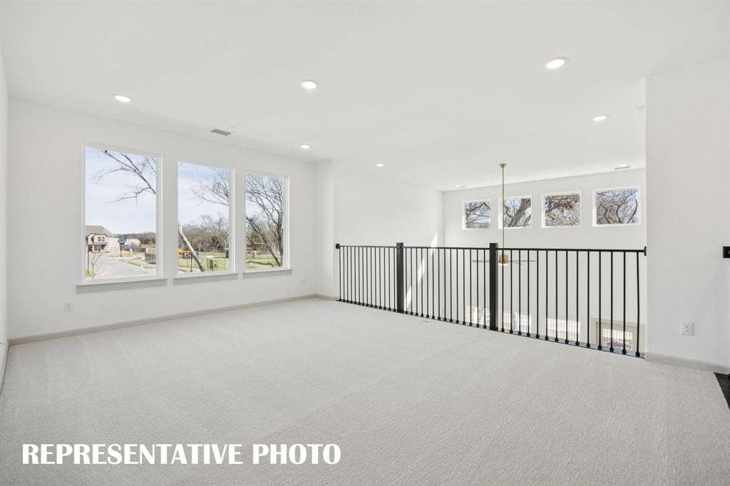 1401 Mistflower Lane, Celina, TX 75009 Open and airy, you'll find plenty of space for family fun in this outstanding game room! REPRESENTATIVE PHOTO