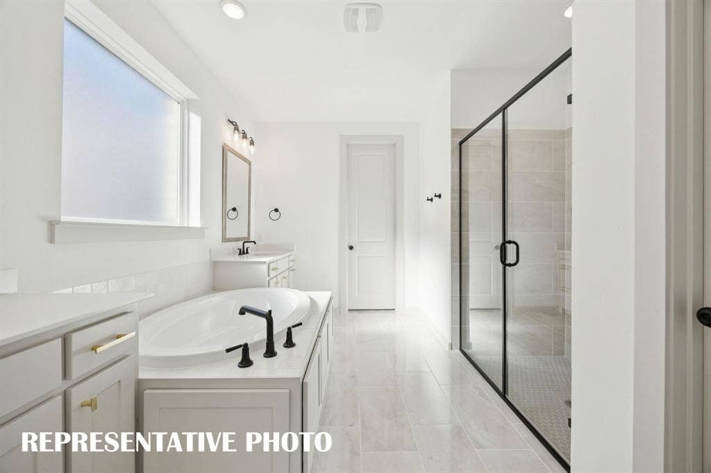 1401 Mistflower Lane, Celina, TX 75009 Whether it's soaking your cares away or indulging in a long, luxurious shower, this owner's bath has it all! REPRESENTATIVE PHOTO