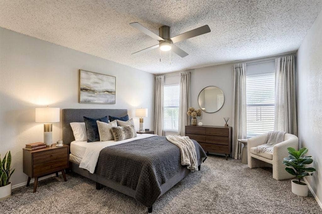 2039 Angelica Way, Dallas, TX 75217 Virtually Staged -Bedroom featuring wall-to-wall carpeting, dual windows, and a ceiling-mounted light fixture with a fan