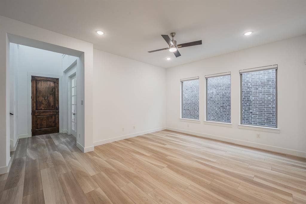 Wood-finish durable LVP flooring and plenty of natural light in the living room