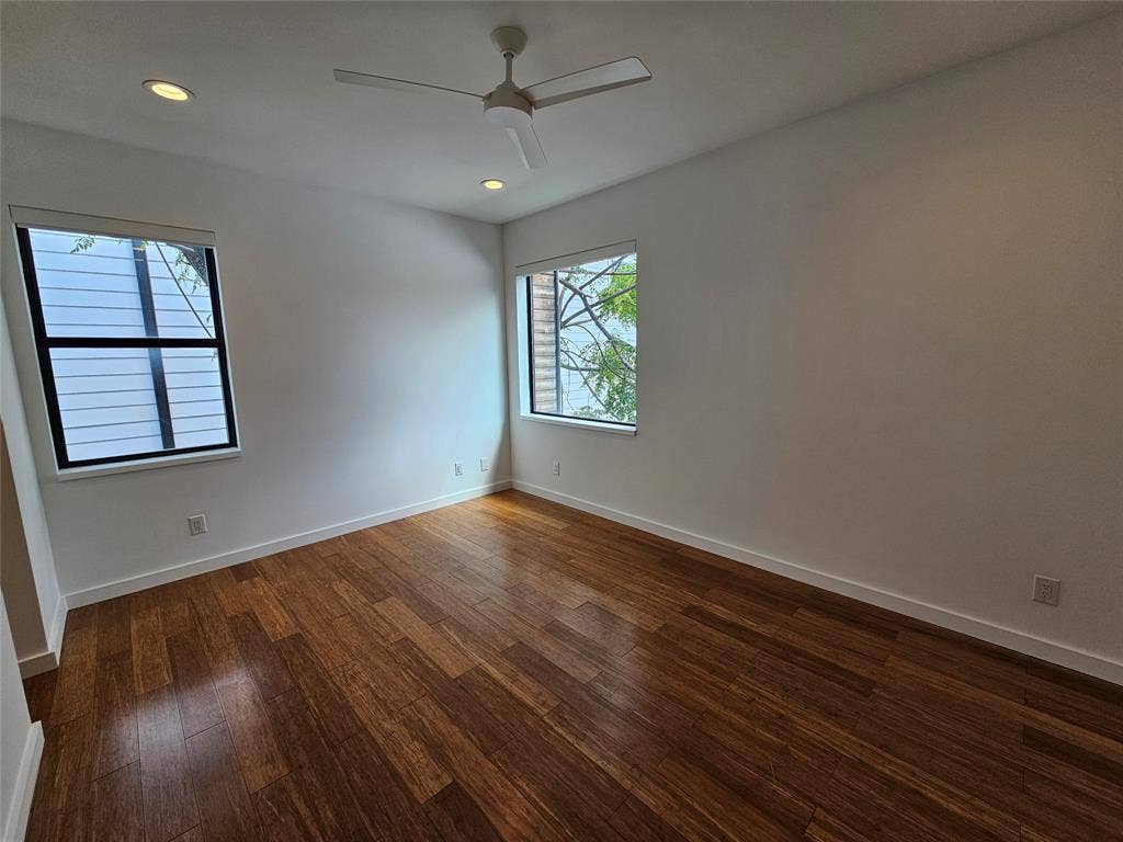 4215 Roseland Avenue, Dallas, TX 75204 Room featuring wood-finish flooring, recessed lighting, a modern ceiling fan, and dual windows