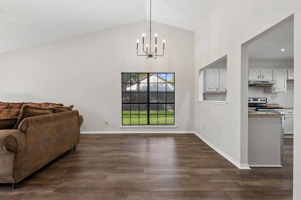 Open Living to dining area space with natural light.