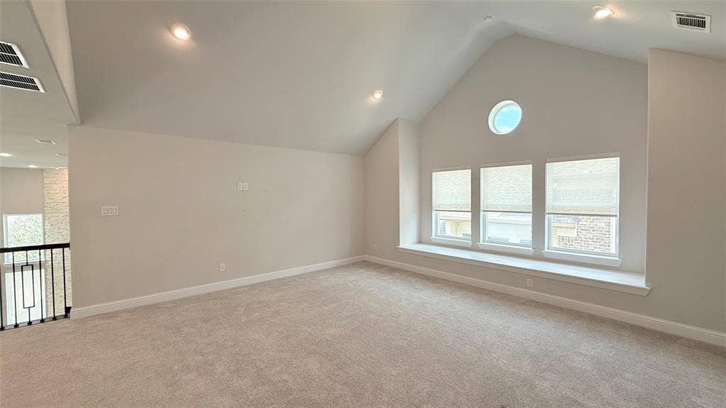 315 Chandan Way, Irving, TX 75063 Vaulted ceiling featuring recessed lighting, a circular accent window, and a built-in window seat