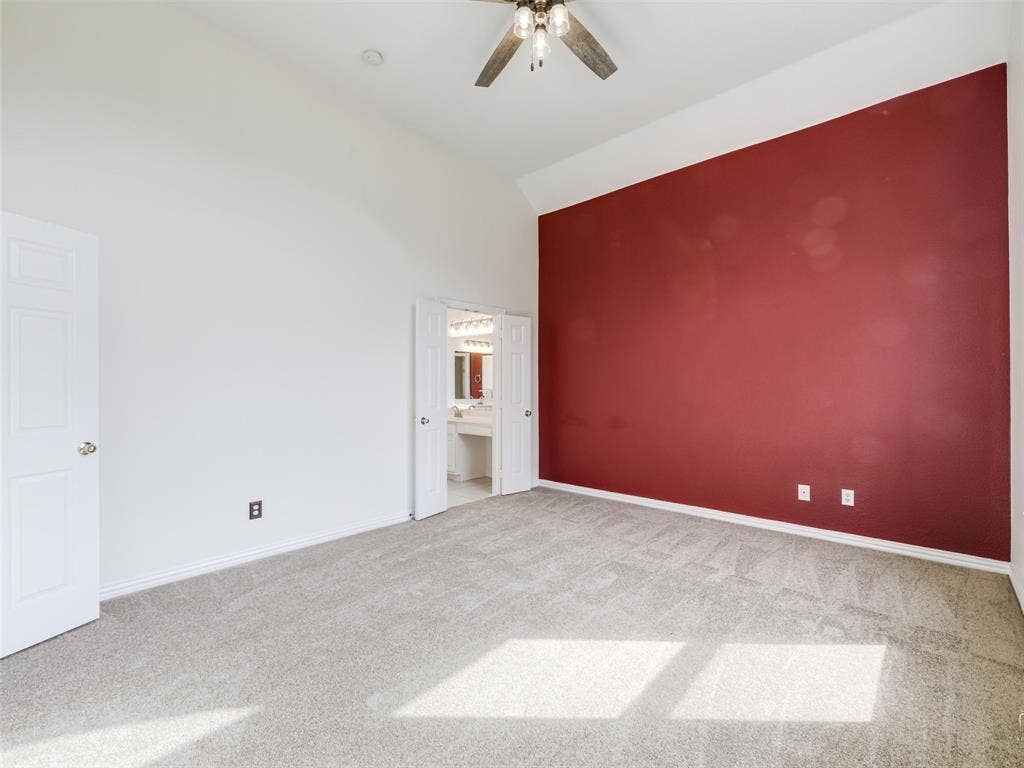3504 Anita Drive, McKinney, TX 75070 Primary bedroom with vaulted ceilings, carpeted flooring, and a ceiling fan with integrated lighting