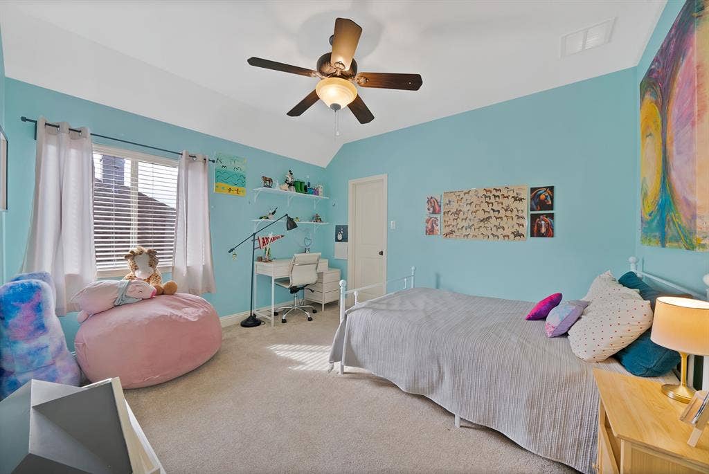 2141 Waterrock Drive, Allen, TX 75013 Vaulted ceilings, neutral carpeting, and a ceiling-mounted light fixture with integrated fan