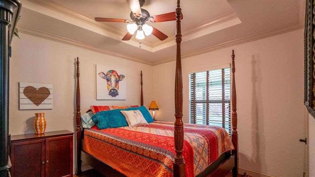 4015 Sioux Court, Granbury, TX 76048 Guest bedroom hosts a queen sized bed