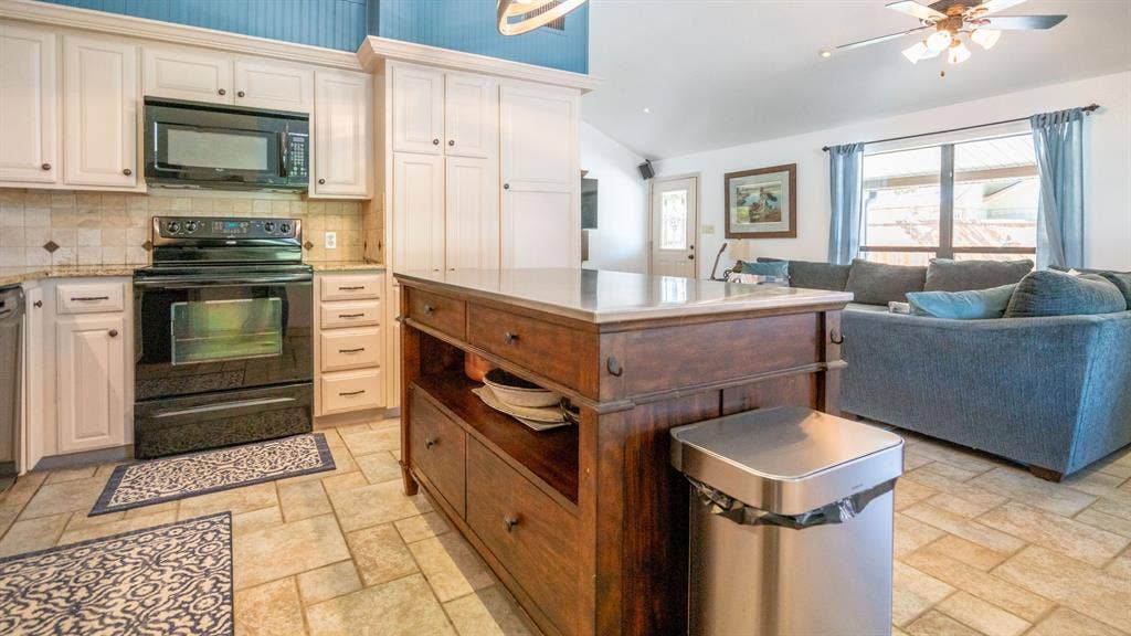 4015 Sioux Court, Granbury, TX 76048 Kitchen island with extra storage and seating