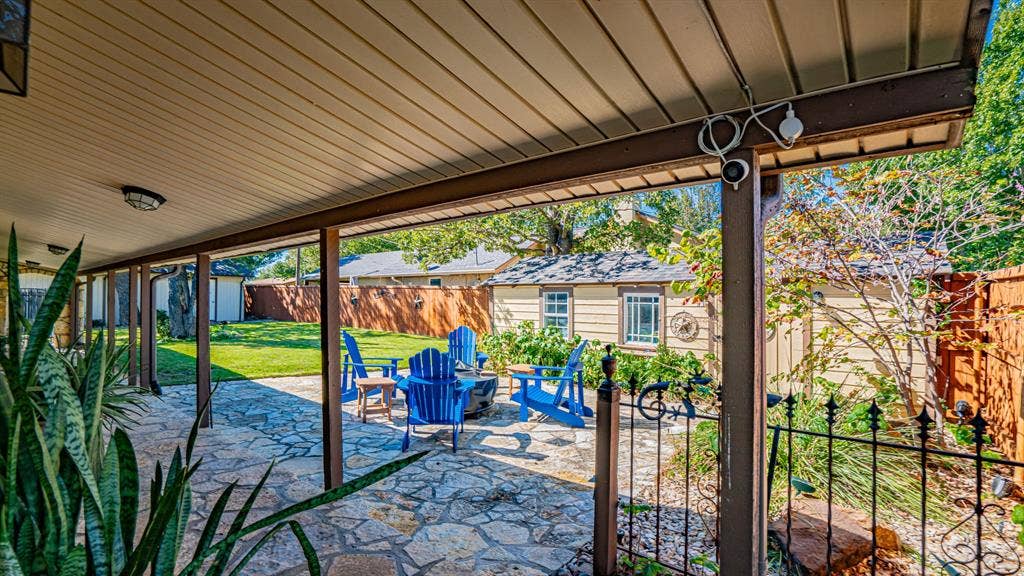 4015 Sioux Court, Granbury, TX 76048 Flagstone patio area in side yard. Vinyl facia for low maintenance