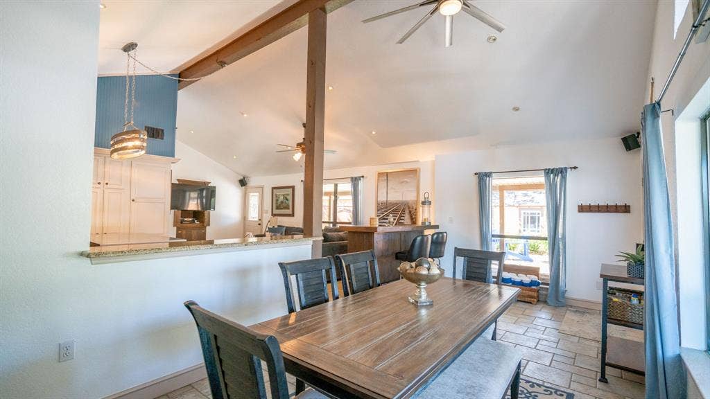 4015 Sioux Court, Granbury, TX 76048 Spacious dining area with tile flooring and lots of natural light and access to the back patio