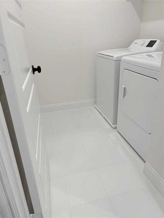 2528 Brunswick Way, Allen, TX 75013 Utility room featuring white ceramic tile flooring and a solid-core door with matte black hardware
