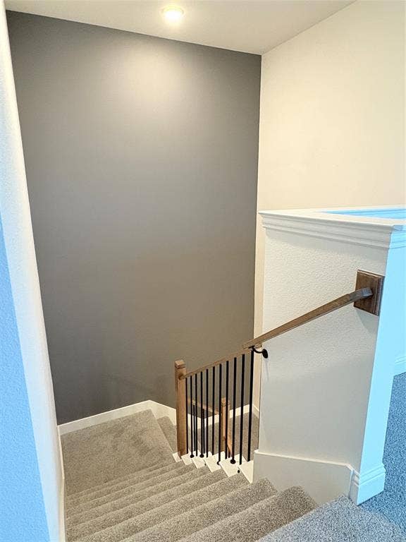 2528 Brunswick Way, Allen, TX 75013 Staircase featuring wall-to-wall carpeting, wood-finish handrail, and matte black metal balusters