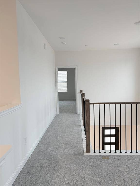2528 Brunswick Way, Allen, TX 75013 Neutral interior hallway featuring carpeted flooring, recessed lighting, and a staircase railing with wood posts and metal balusters