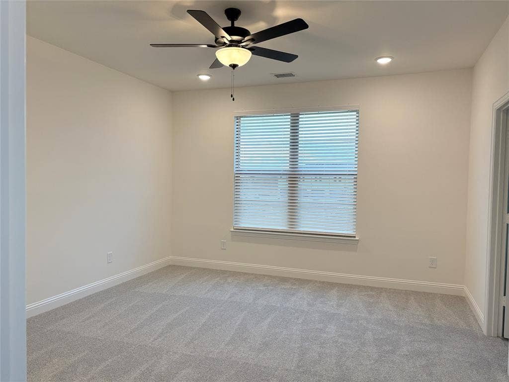 2528 Brunswick Way, Allen, TX 75013 Neutral-toned carpeting, matte black ceiling fan with integrated lighting, recessed lighting, and horizontal window blinds