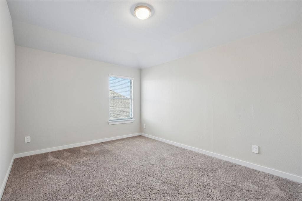 135 Lost Maples Way, Waxahachie, TX 75165 Neutral-toned walls, high-pile carpeting, single window with blinds, and a circular flush-mount ceiling light fixture