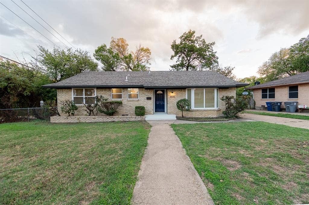 2406 Cliff Teen Court, Dallas, TX 75233 Single-story brick exterior featuring a low-slope roof, multi-pane windows, a bay window, and a central front entry