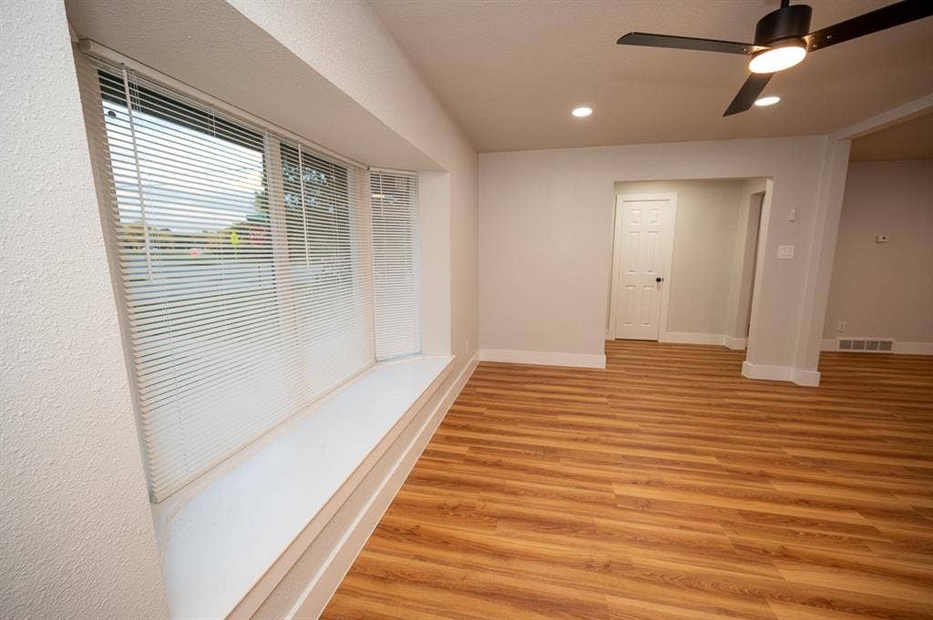 2406 Cliff Teen Court, Dallas, TX 75233 Bay window with built-in bench seating, wood-finish flooring, recessed lighting, and a modern ceiling fan with integrated lighting