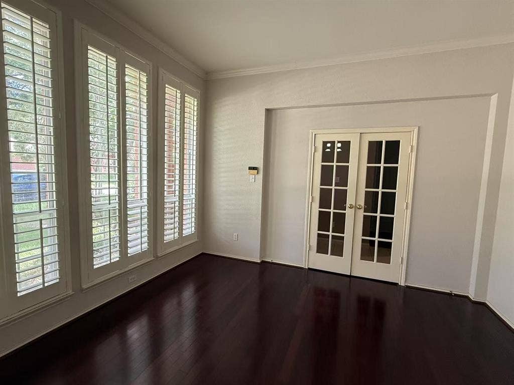 1307 Capstan Drive, Allen, TX 75013 Wood-finish flooring, multi-pane glass French doors, and oversized windows featuring custom plantation shutters