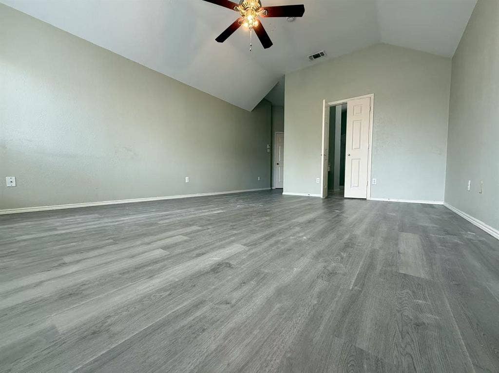 1307 Capstan Drive, Allen, TX 75013 Vaulted ceilings, wood-finish flooring, and a ceiling fan with integrated lighting