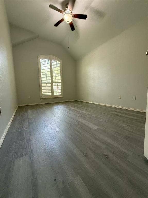 1307 Capstan Drive, Allen, TX 75013 Vaulted ceilings featuring wood-finish flooring, an arched window with plantation shutters, and a central ceiling fan