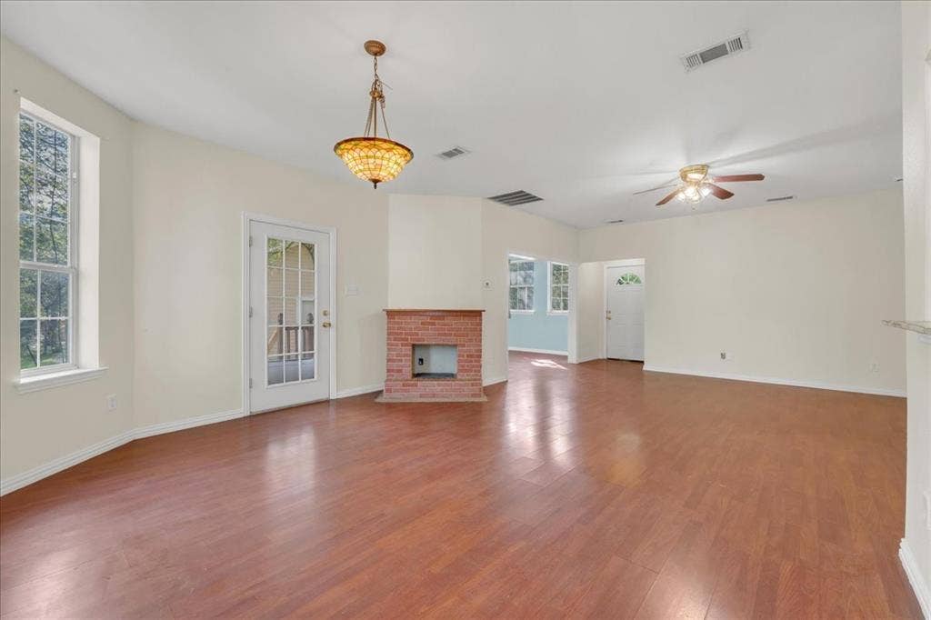 Faux fireplace in the back unit to accentuate the large open floor plan layout.