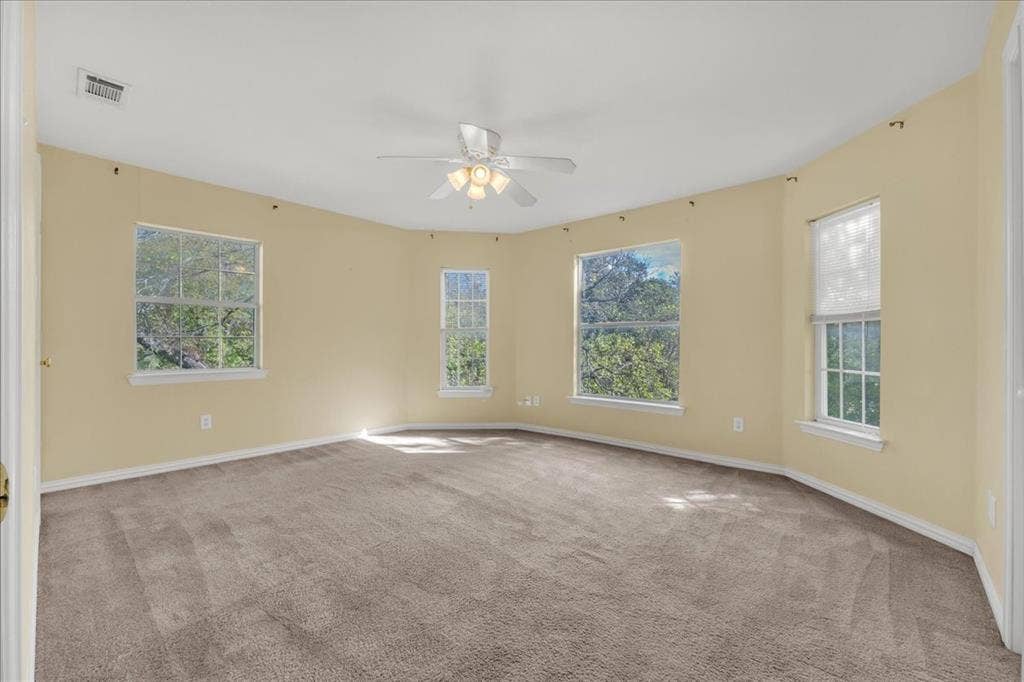 Bedroom #1 upstairs in the back unit. Offers great natural sunlight, two closets, and a view of the backyard.